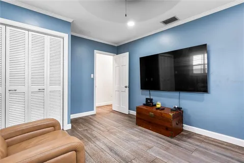 a bed room with a bed and a book shelf