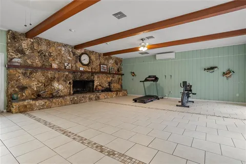 a living room with a couch and a fireplace