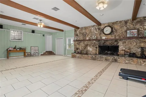 a bed room with a chair and a window