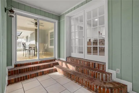 a view of a backyard with sitting area