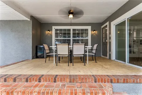 a view of a swimming pool with a patio