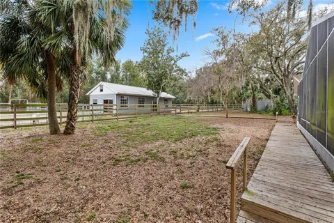 a backyard of a house with lots of green space