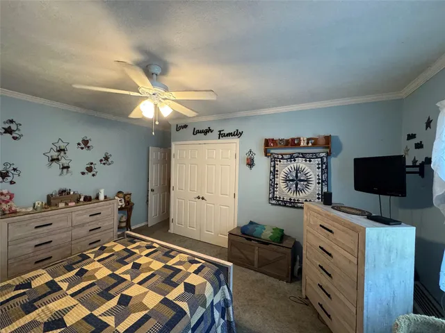 a bedroom with a bed and furniture