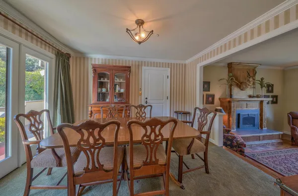 a kitchen with furniture and windows