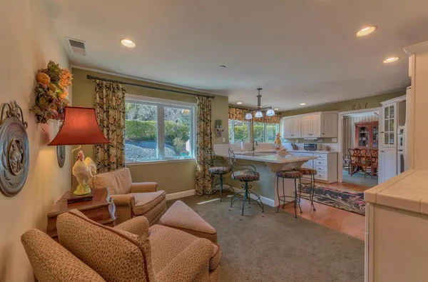a living room with furniture and a rug
