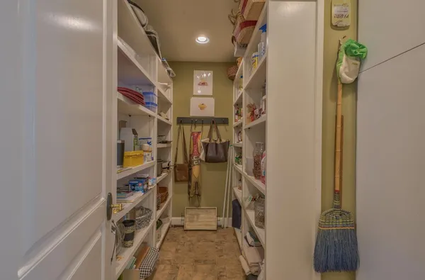 a living room with furniture a rug and a large window