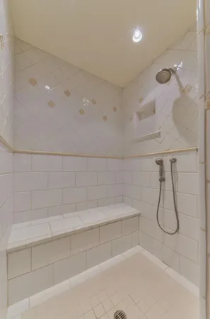 a bedroom with a large bed and a tv