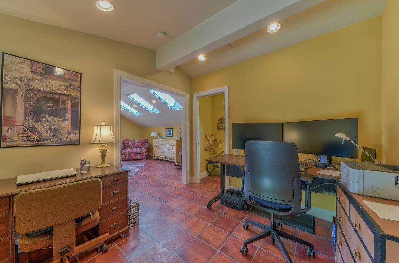 190 San Benancio Road Salinas, CA 93908 - Photo 43 of 61 a living room with a couch and a bookshelf with wooden walls