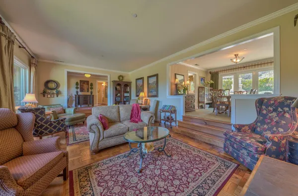 a living room with furniture and a rug