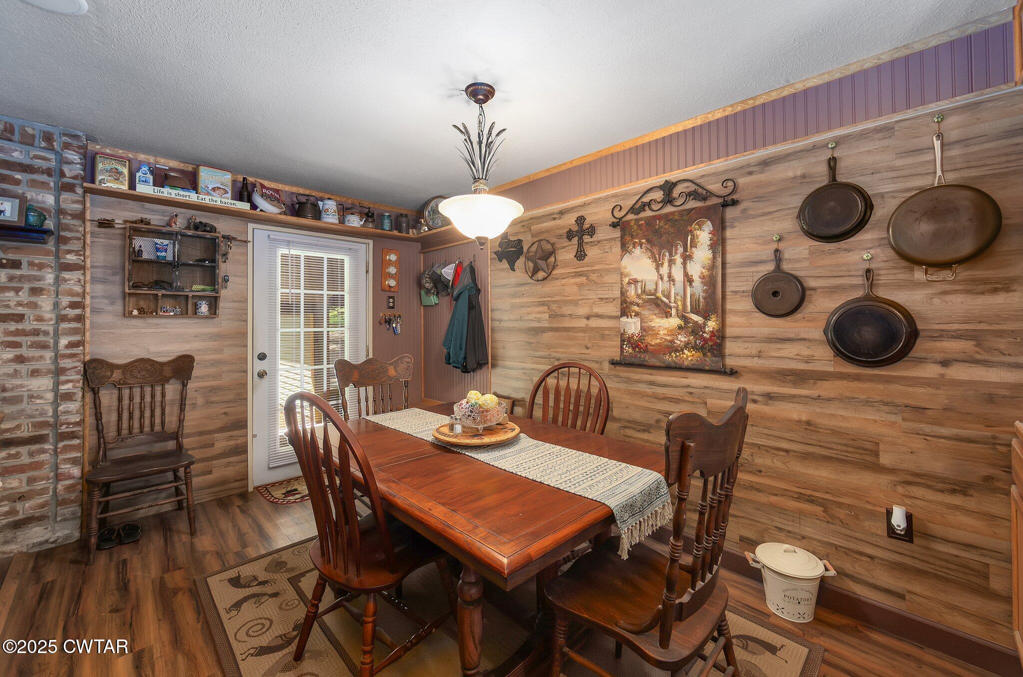 480 Roby Road Reagan, TN 38368 - Photo 8 of 38 a view of a dining room with furniture and wooden floor
