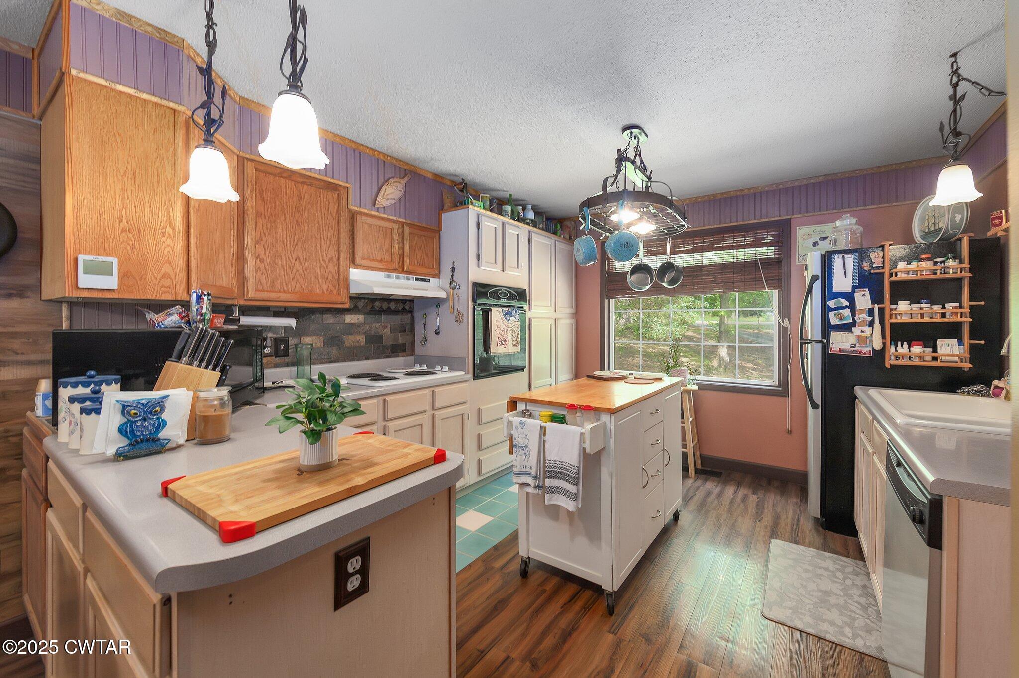 480 Roby Road Reagan, TN 38368 - Photo 10 of 38 a kitchen that has a lot of cabinets in it