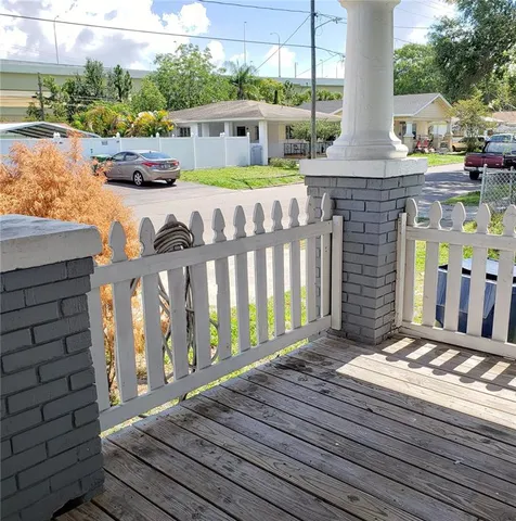 a front view of a house with outdoor seating
