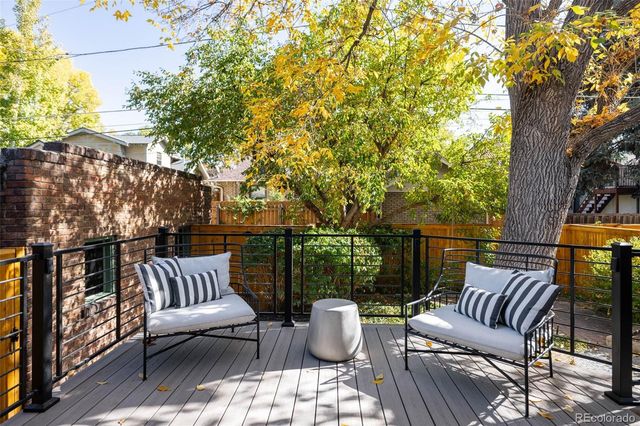 a view of a patio with furniture and a yard
