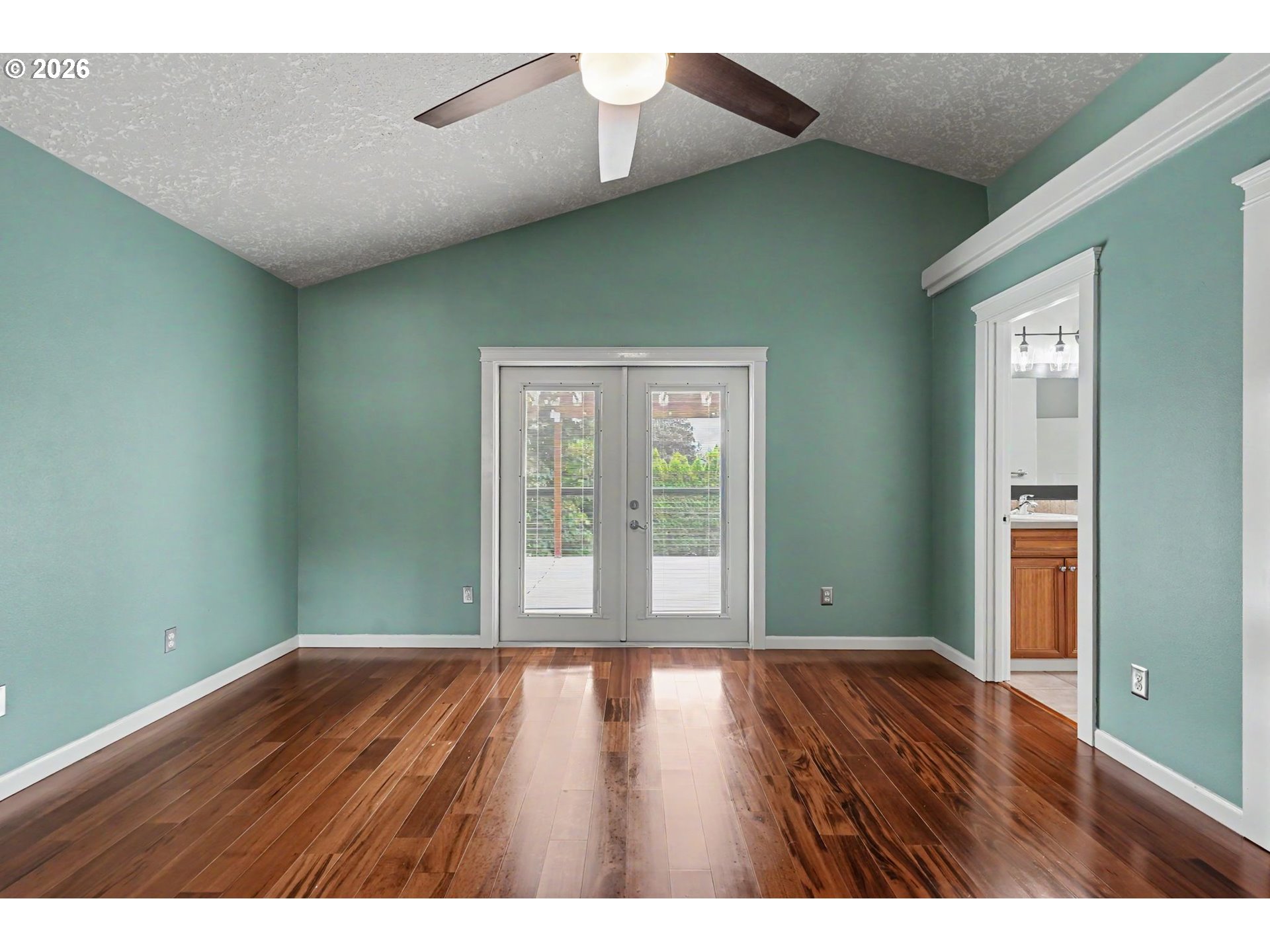 1462 Barnick Road Northeast Keizer, OR 97303 - Photo 25 of 48 a view of an empty room with wooden floor and a window