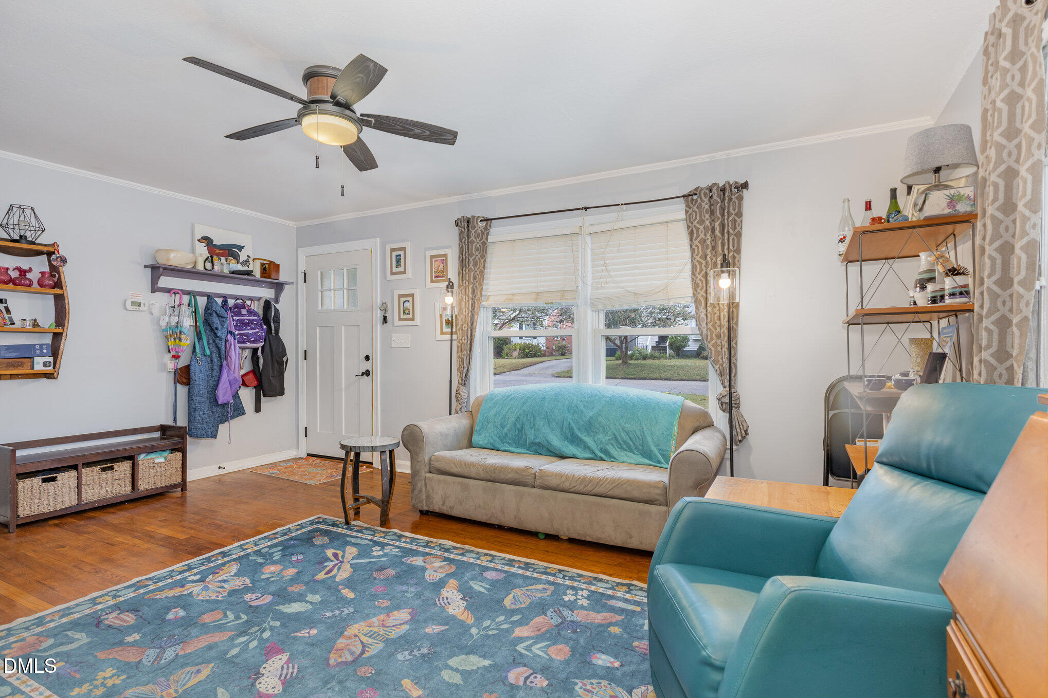 2723 Layden Street Raleigh, NC 27603 - Photo 6 of 21 a living room with furniture and a flat screen tv