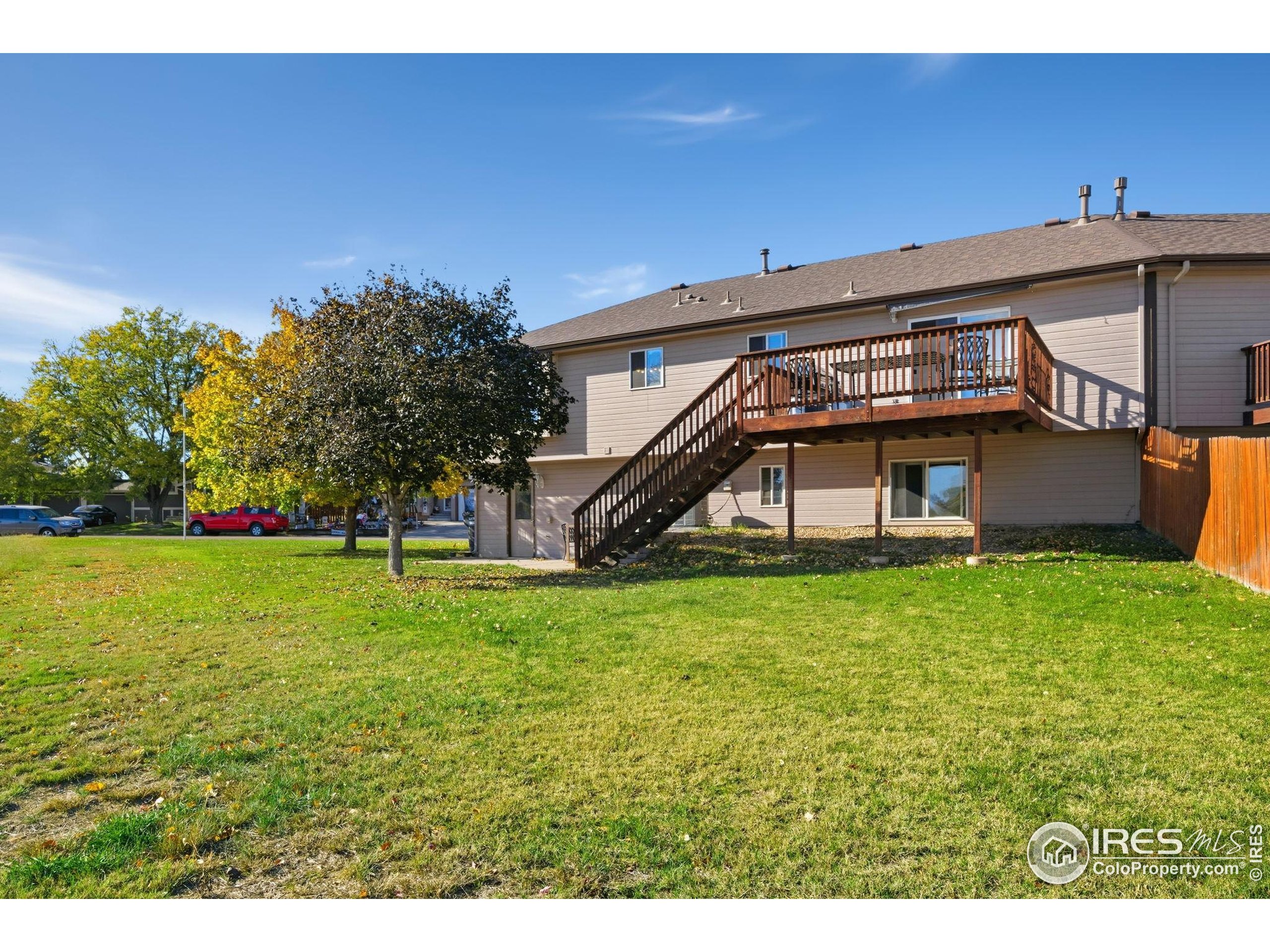 3340 35th Street Greeley, CO 80634 - Photo 2 of 10 a view of a house with a yard