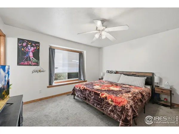 a living room with furniture and flat screen tv