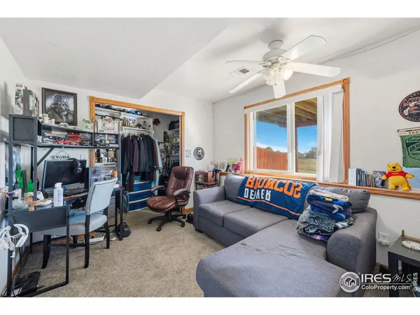 a bathroom with a sink vanity mirror and toilet