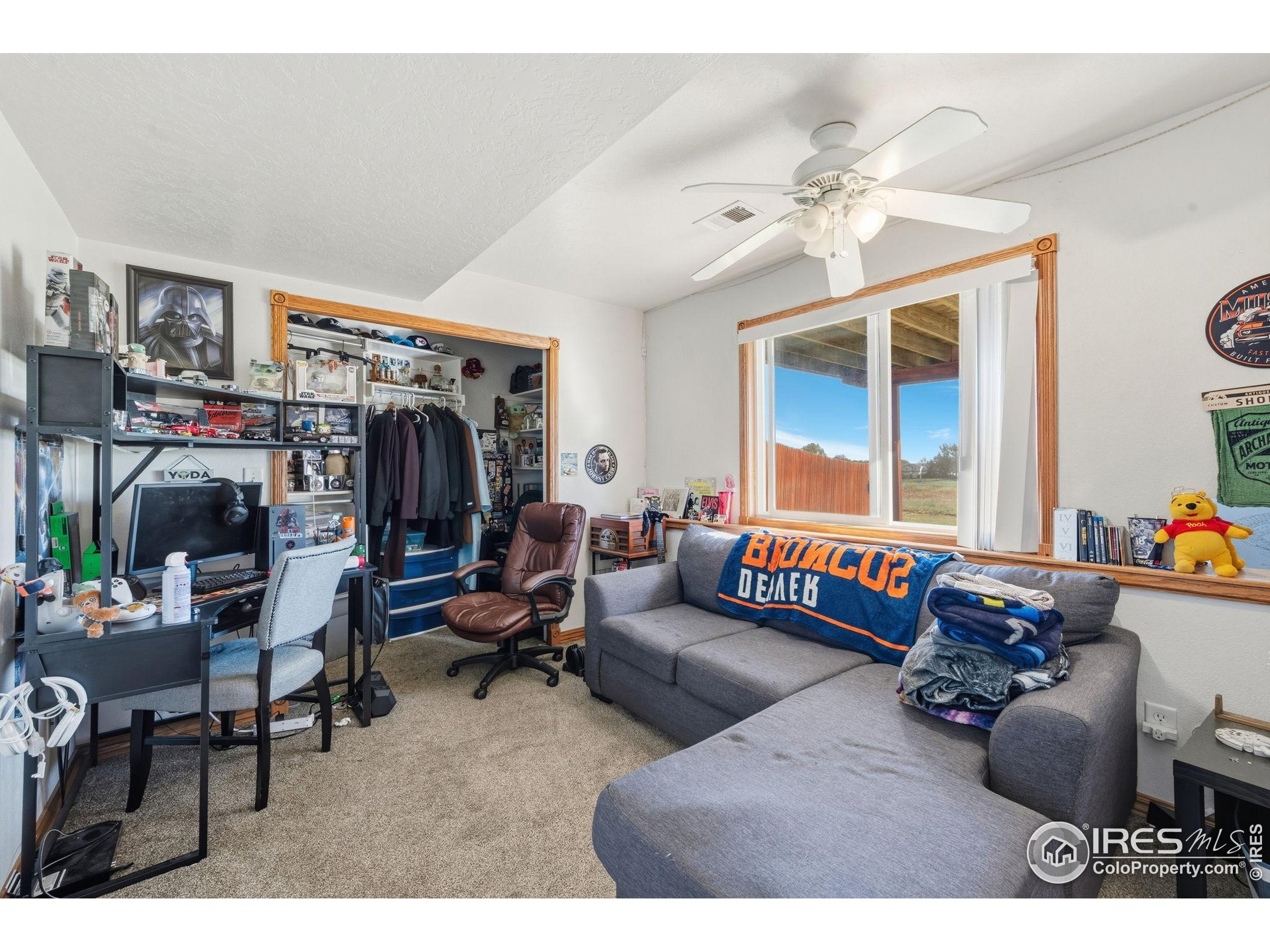 3340 35th Street Greeley, CO 80634 - Photo 9 of 10 a living room filled with furniture