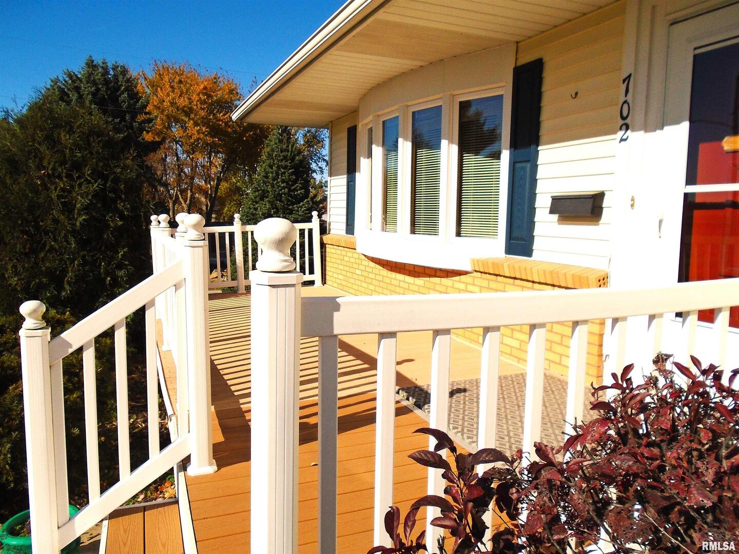 702 High Street Dixon, IA 52745 - Photo 12 of 16 a view of a balcony with outdoor seating