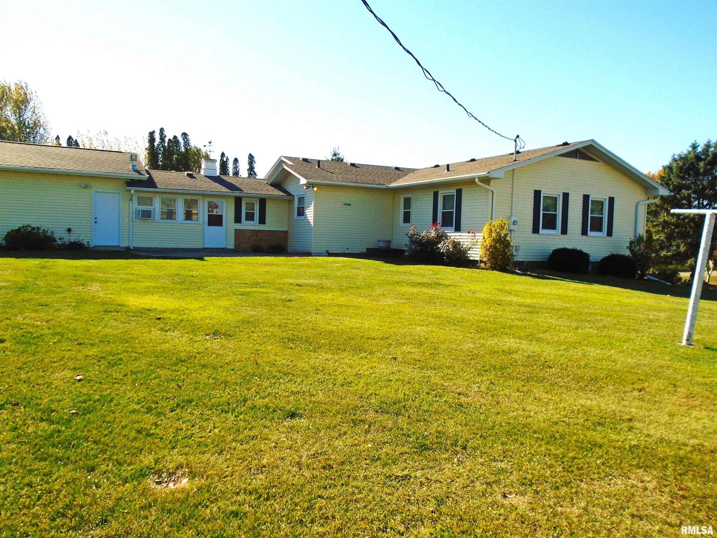 702 High Street Dixon, IA 52745 - Photo 16 of 16 a front view of a house with swimming pool having outdoor seating