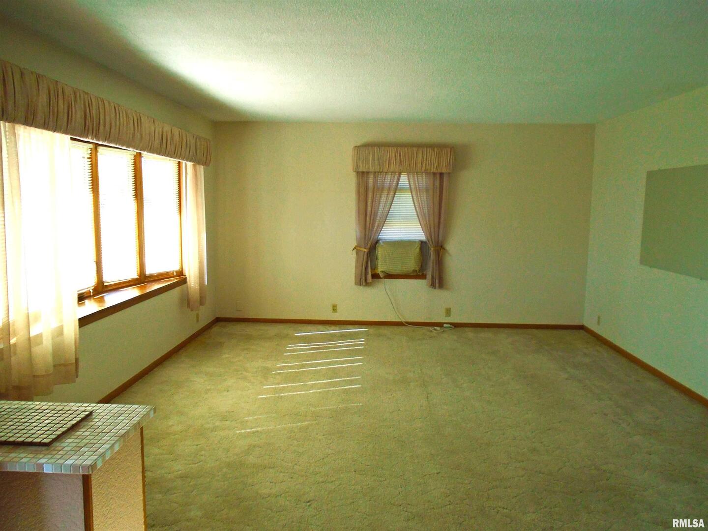 702 High Street Dixon, IA 52745 - Photo 2 of 16 a view of a room with window