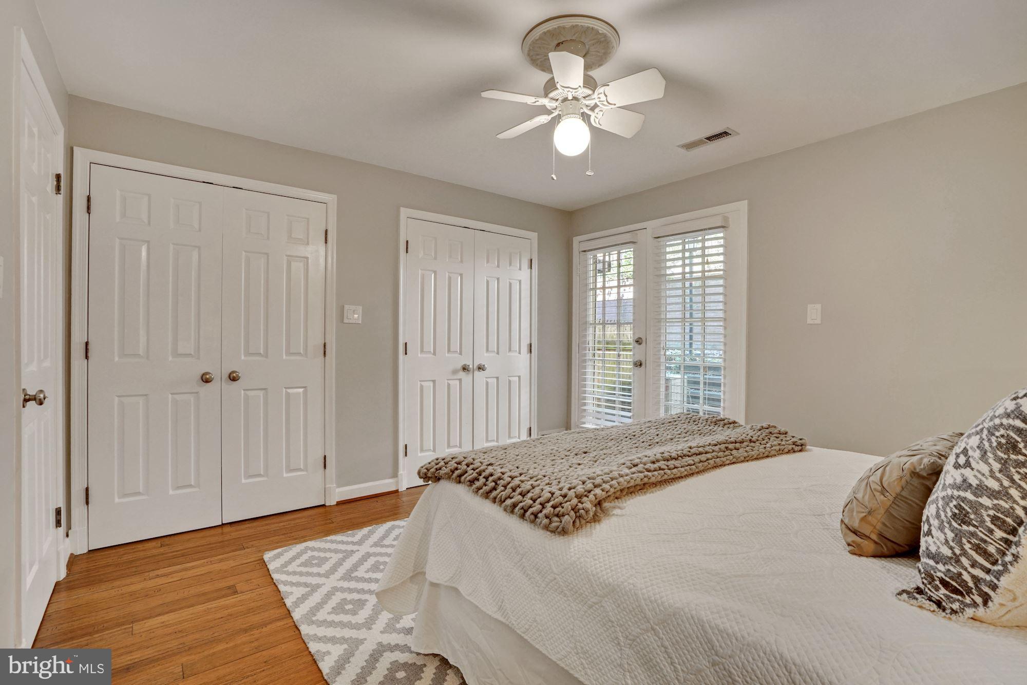 4613 MacArthur Boulevard Northwest, Unit A Washington, DC 20007 - Photo 18 of 26 Doors off the bedroom lead to the patio.