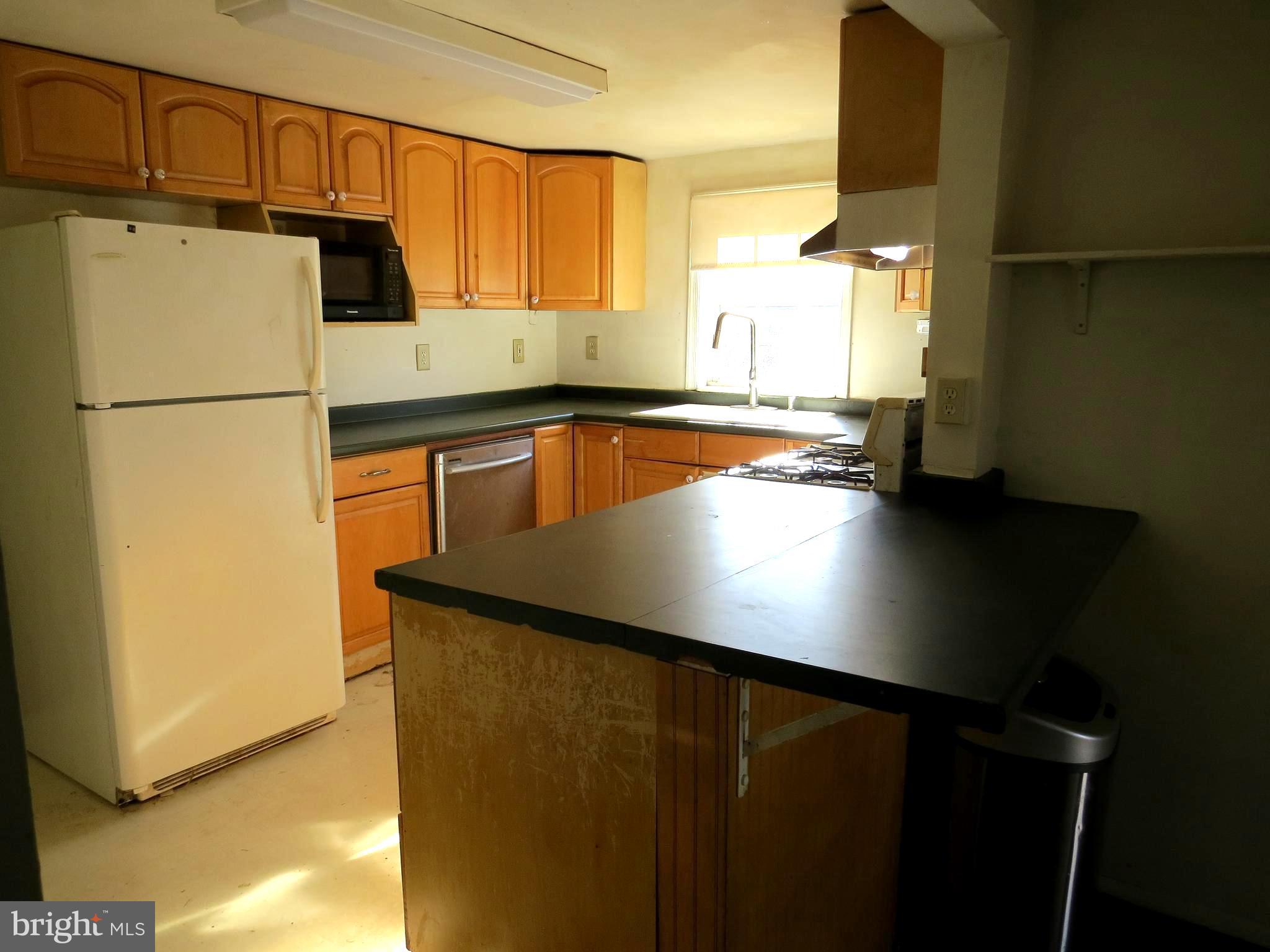 438 Burns Crossing Road Gambrills, MD 21054 - Photo 25 of 31 a kitchen with a refrigerator a sink and cabinets