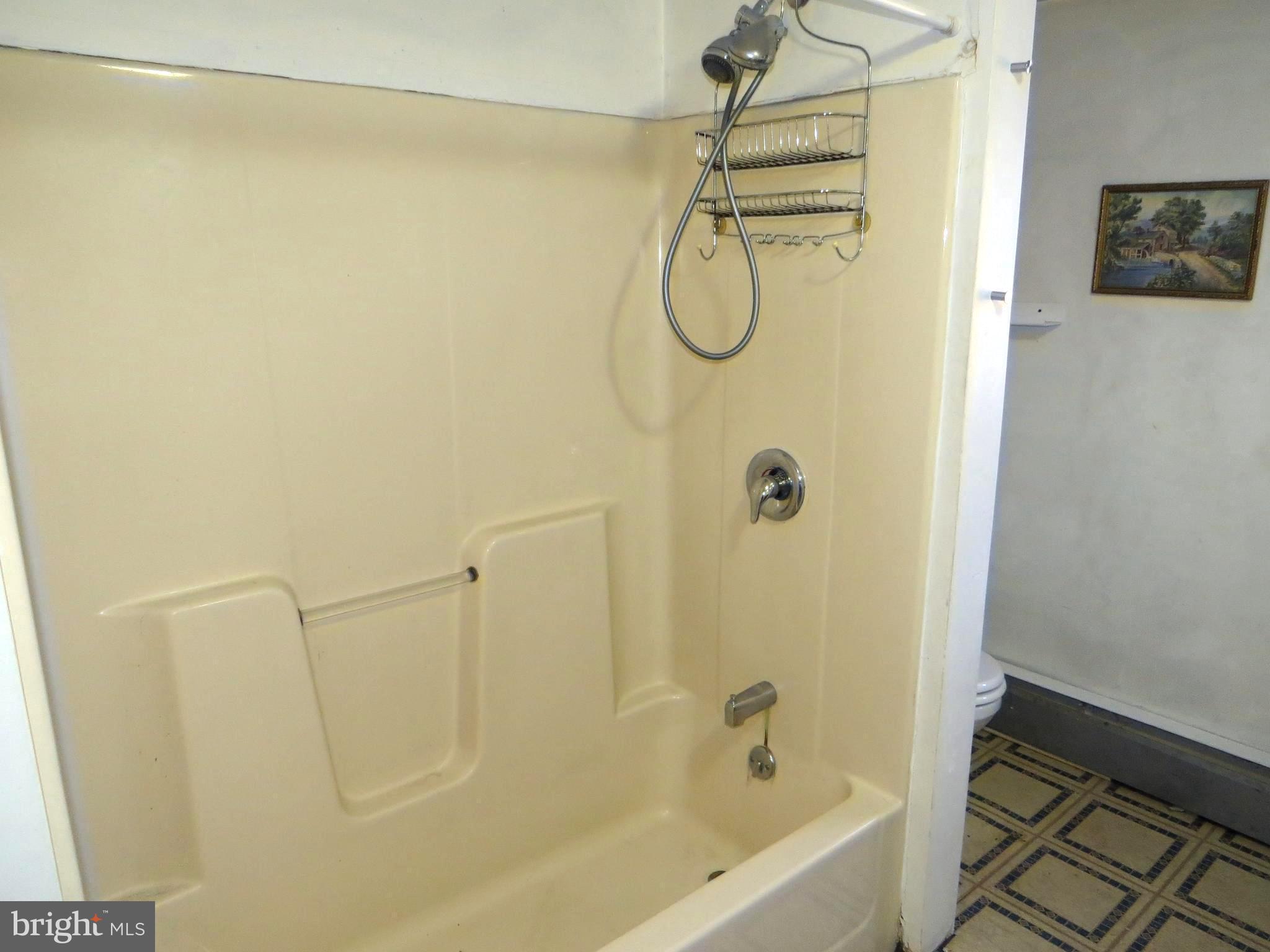 438 Burns Crossing Road Gambrills, MD 21054 - Photo 27 of 31 a bathroom with a shower and a bathtub