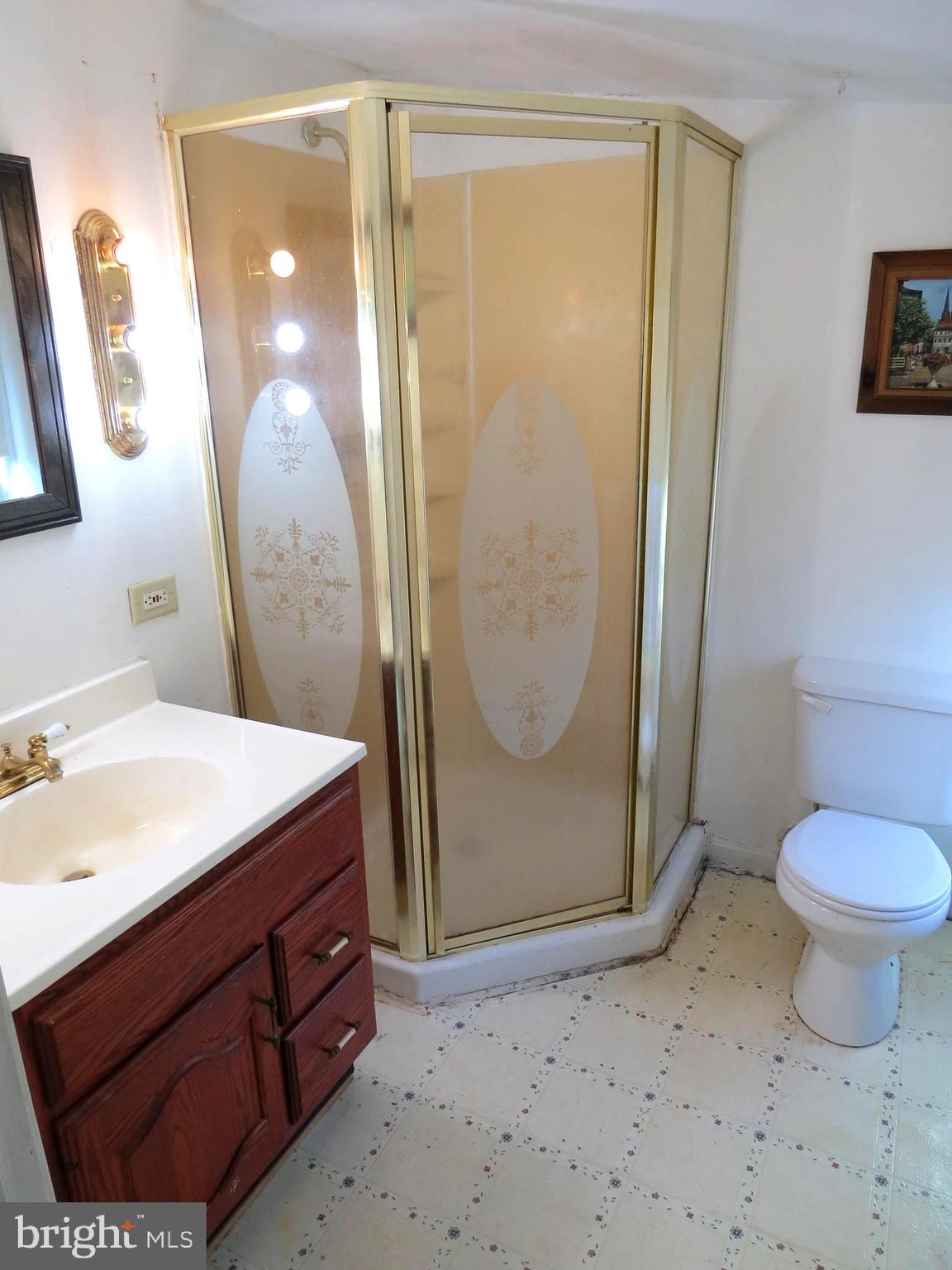 438 Burns Crossing Road Gambrills, MD 21054 - Photo 30 of 31 a bathroom with a sink a toilet and a mirror