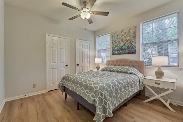 a bedroom with a bed and window