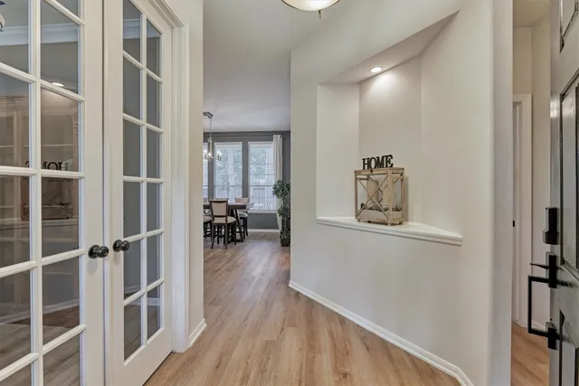 a room with wooden floor and furniture