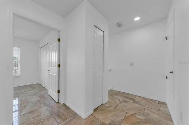 a bathroom with a sink a large mirror and vanity