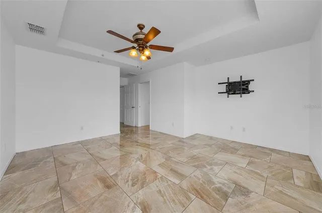 a view of an empty room with a window