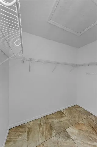 a bathroom with a granite countertop sink mirror toilet and bathtub