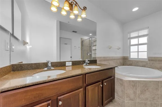 a view of a livingroom with a ceiling fan and window