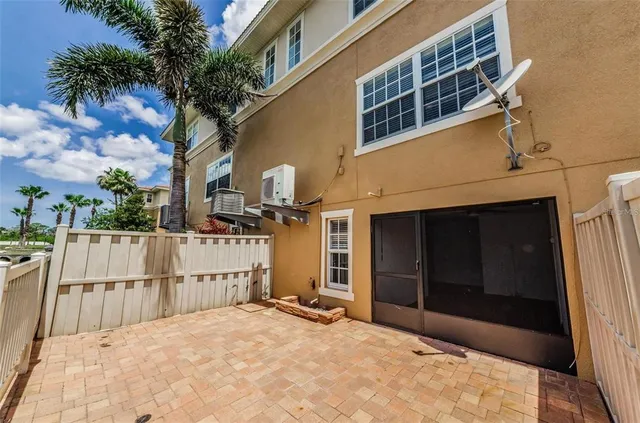 a swimming pool with outdoor seating and yard