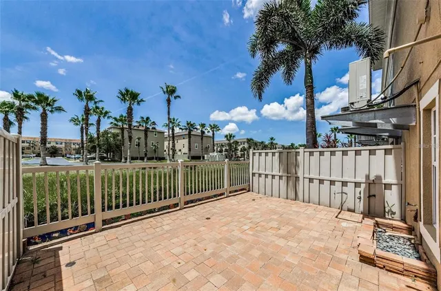 a swimming pool with outdoor seating and yard