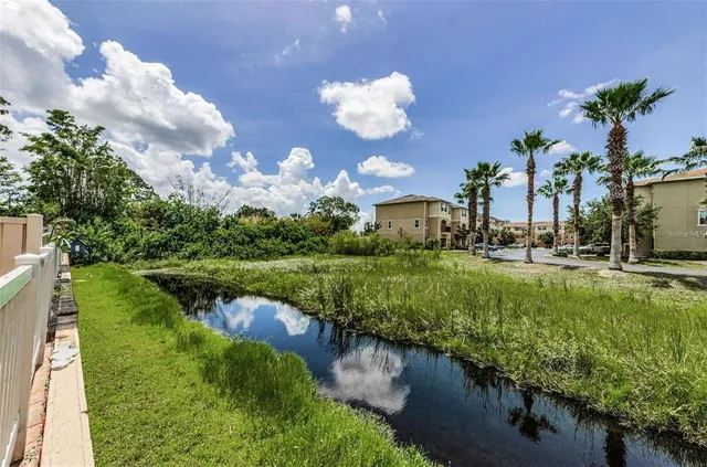 a view of a swimming pool with a lounge chair