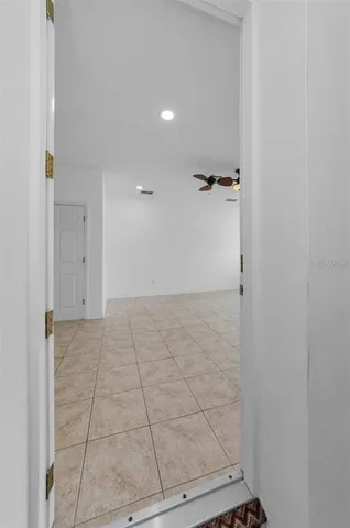 a kitchen with sink a microwave and cabinets