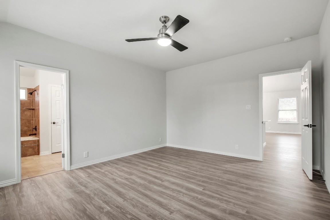 406 Dragon Ridge Road Buda, TX 78610 - Photo 19 of 39 a view of empty room with wooden floor