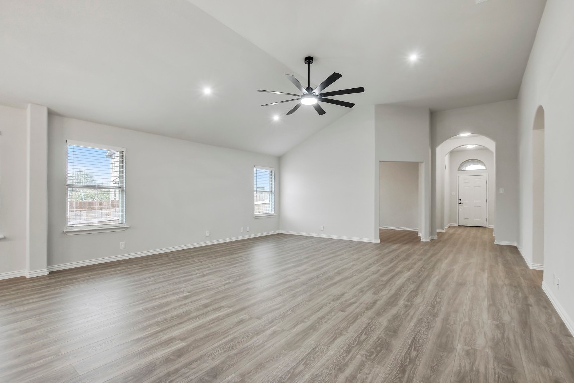 406 Dragon Ridge Road Buda, TX 78610 - Photo 8 of 39 a view of empty room with wooden floor and fan