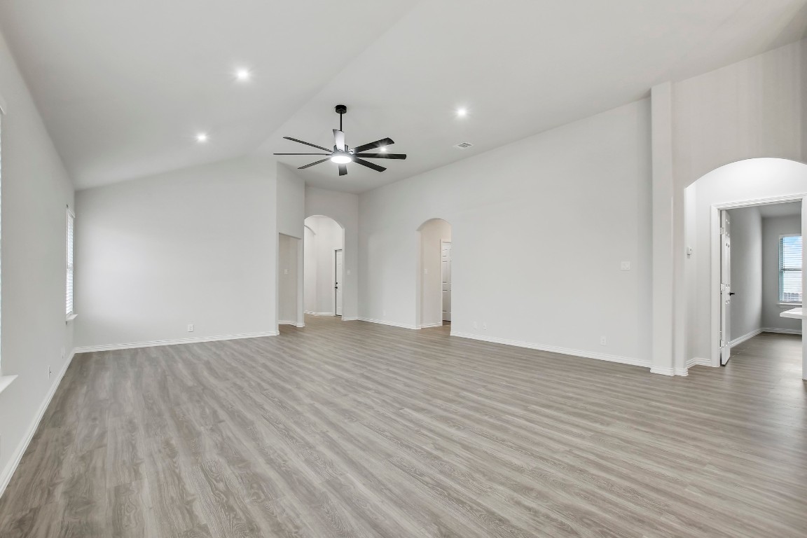 406 Dragon Ridge Road Buda, TX 78610 - Photo 10 of 39 an empty room with wooden floor and fan