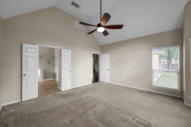 a view of an empty room with a window