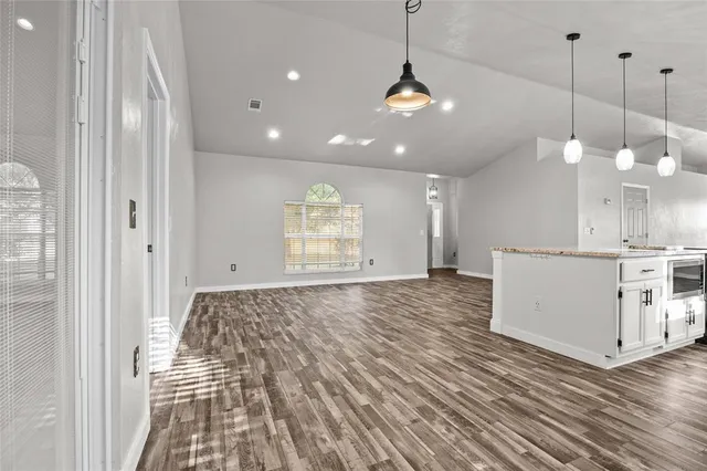 a view of a kitchen and window