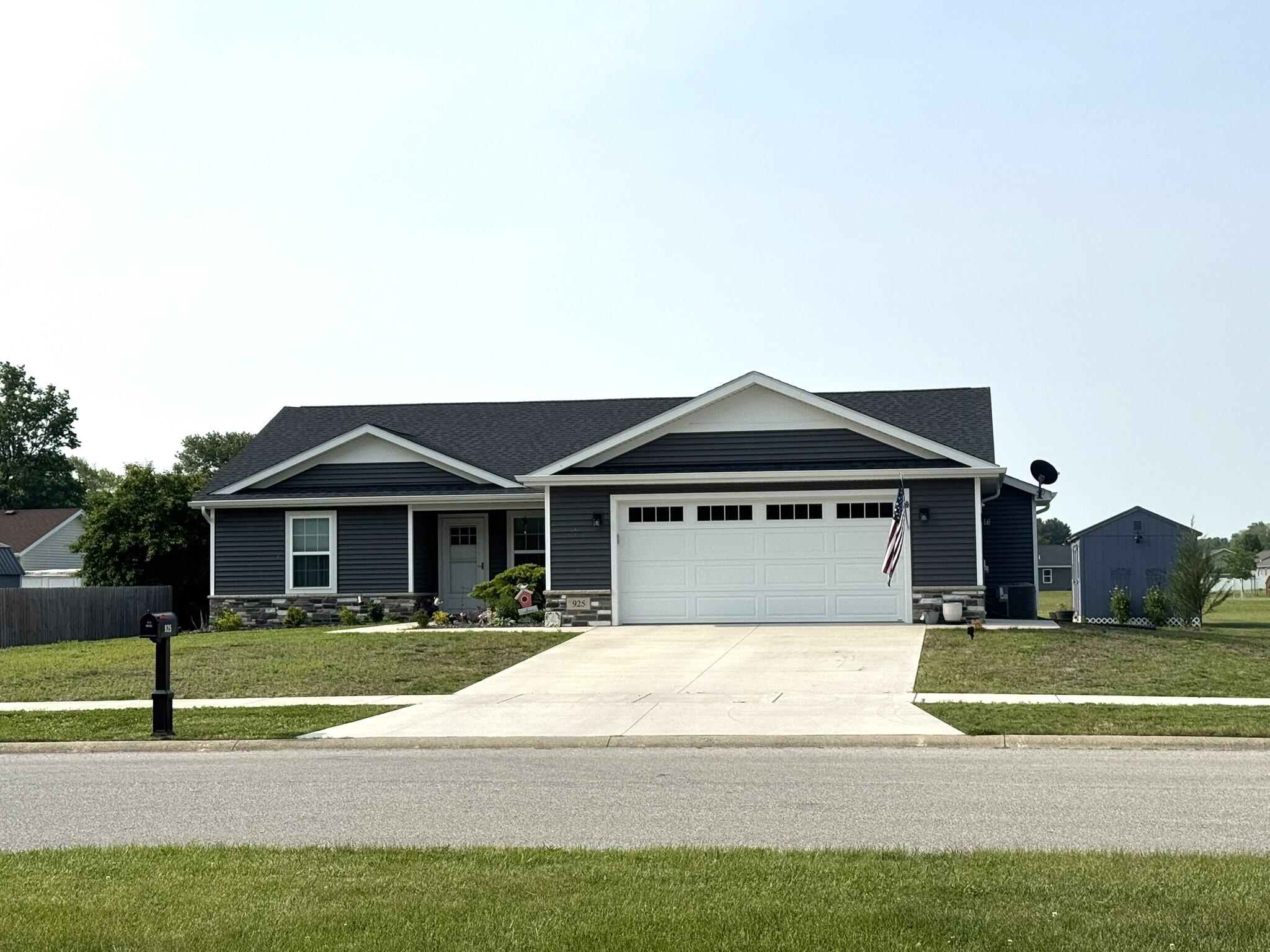 925 6th Avenue Northwest De Motte, IN 46310 - Photo 1 of 22 a front view of a house with a yard