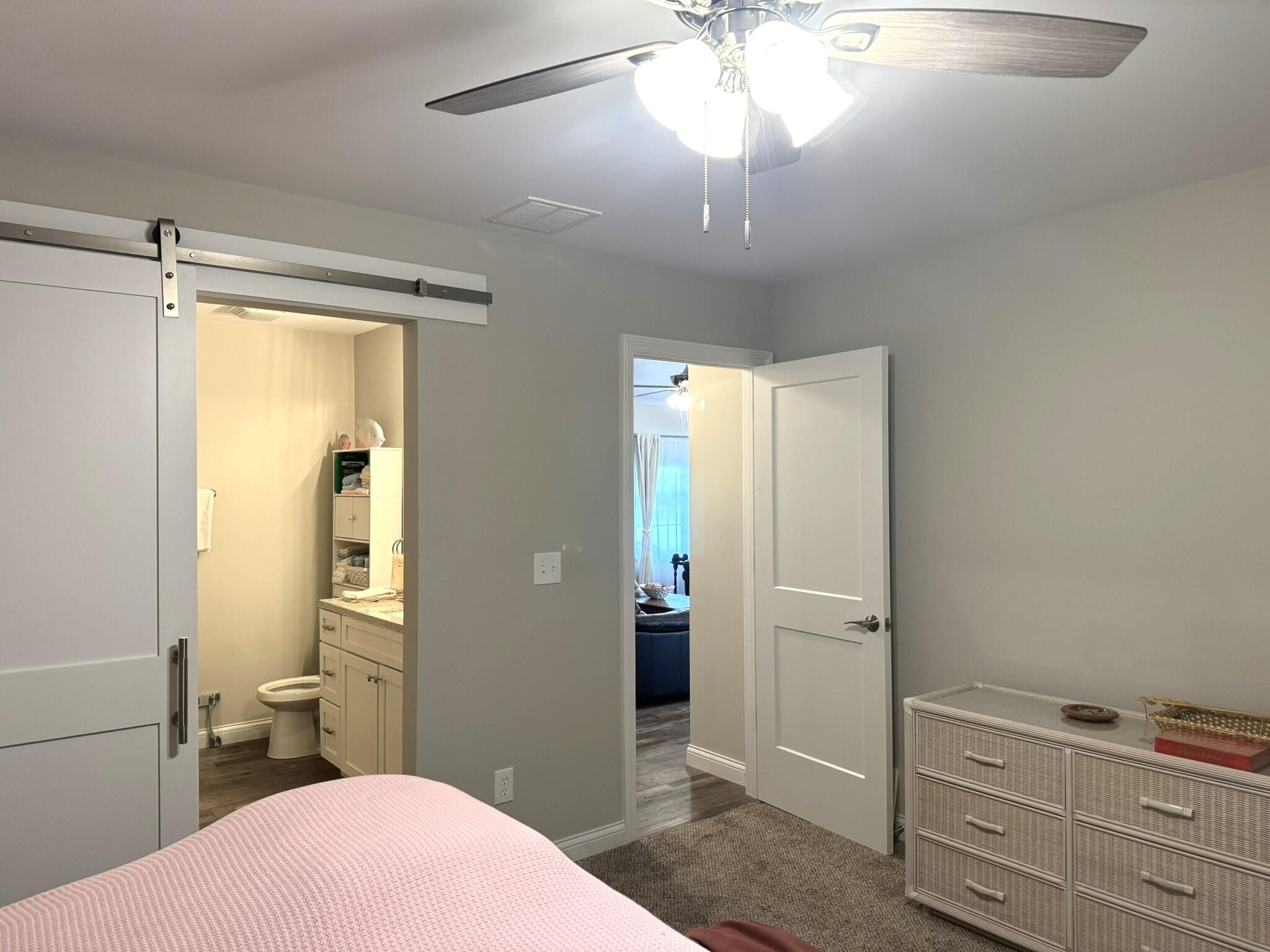 925 6th Avenue Northwest De Motte, IN 46310 - Photo 13 of 22 a bedroom with a bed and a chandelier