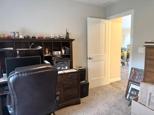 a work room with furniture and a window