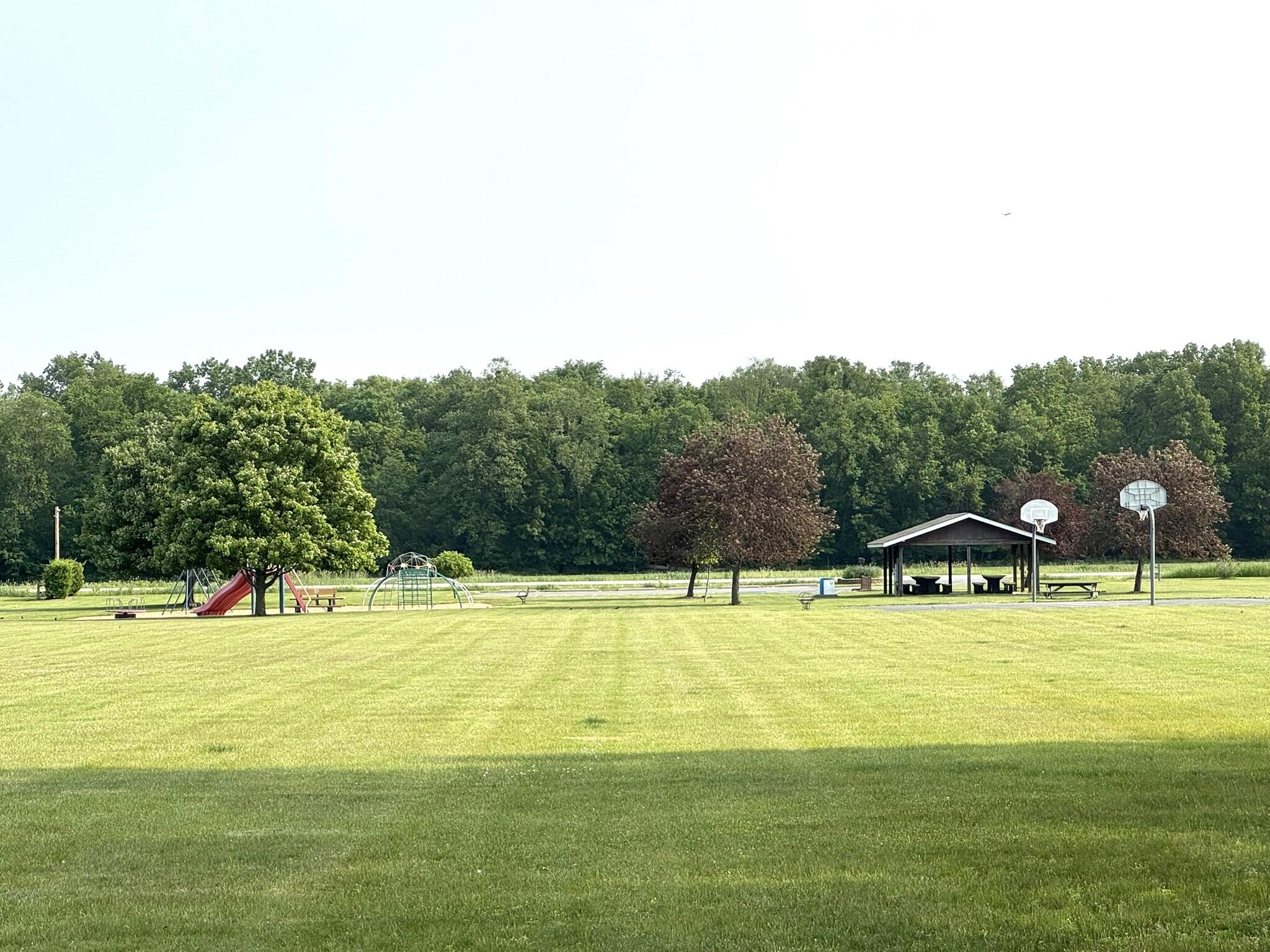 925 6th Avenue Northwest De Motte, IN 46310 - Photo 9 of 22 a view of a swimming pool with an outdoor seating