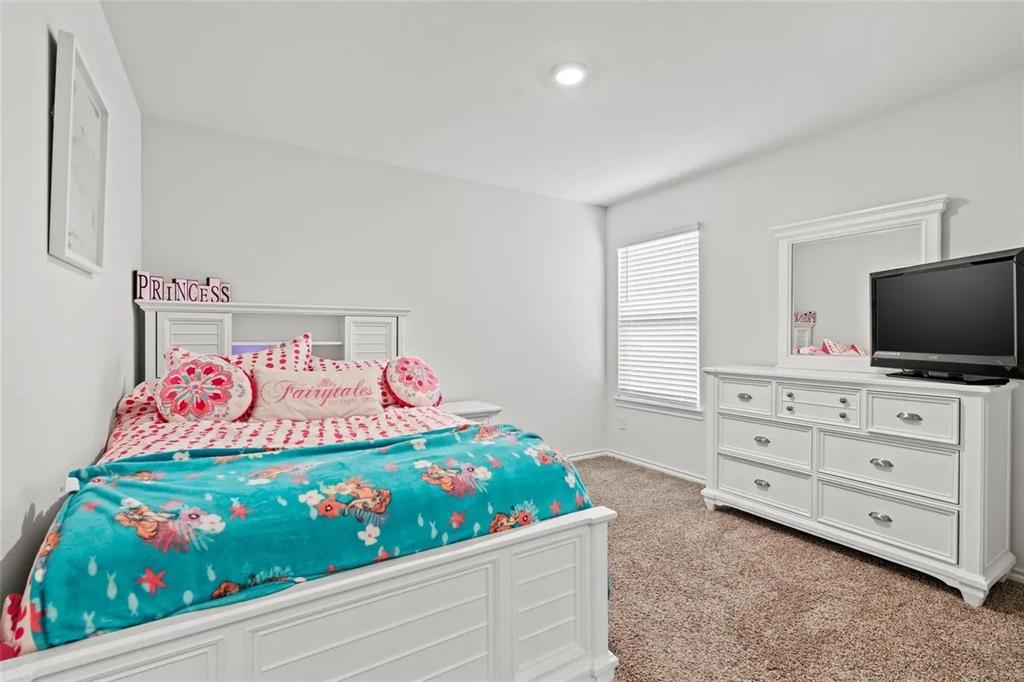 171 Seabiscuit Road Caddo Mills, TX 75135 - Photo 8 of 19 a bedroom with a bed and a tv in it